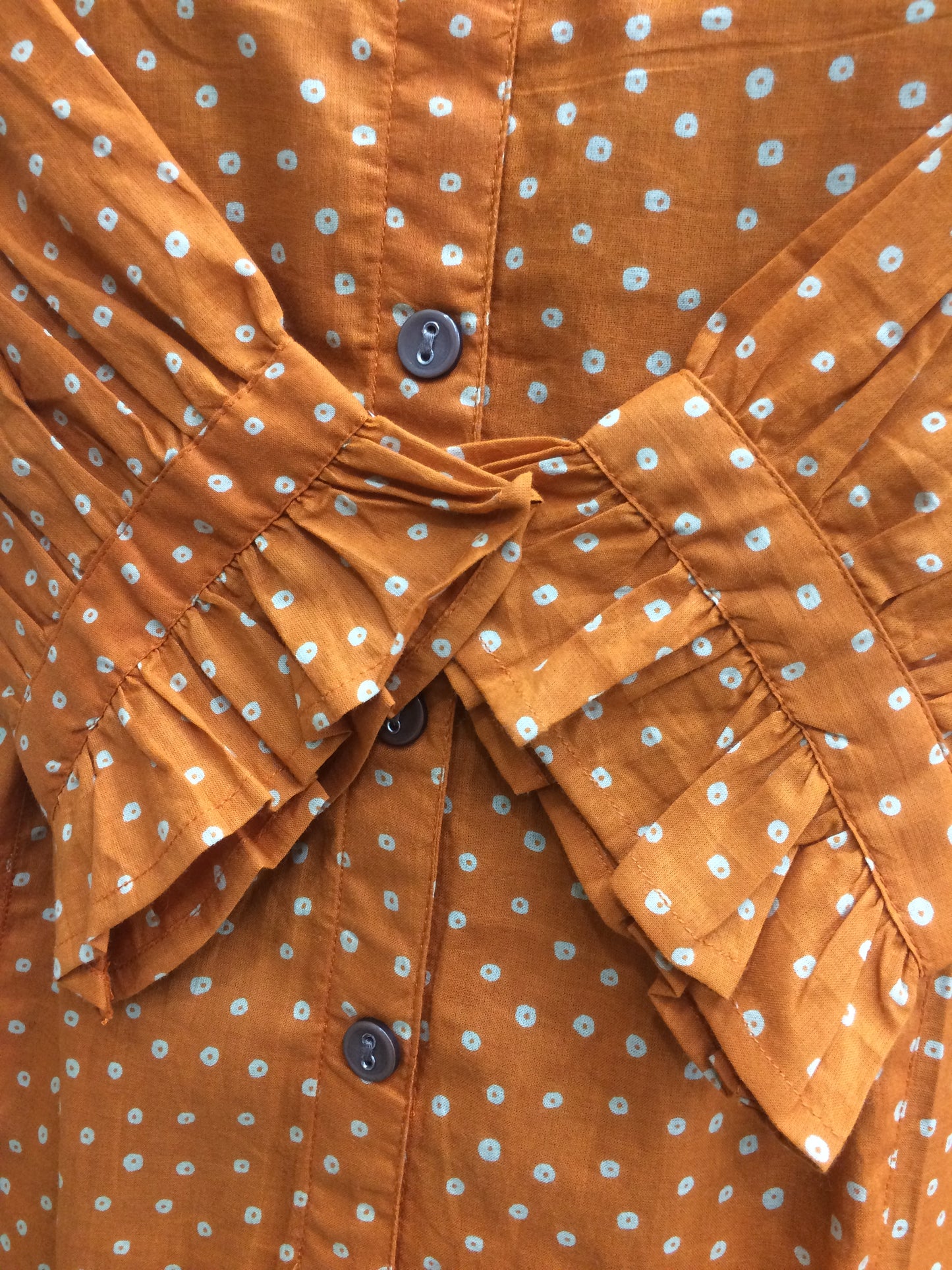 Orange short tunic brown button