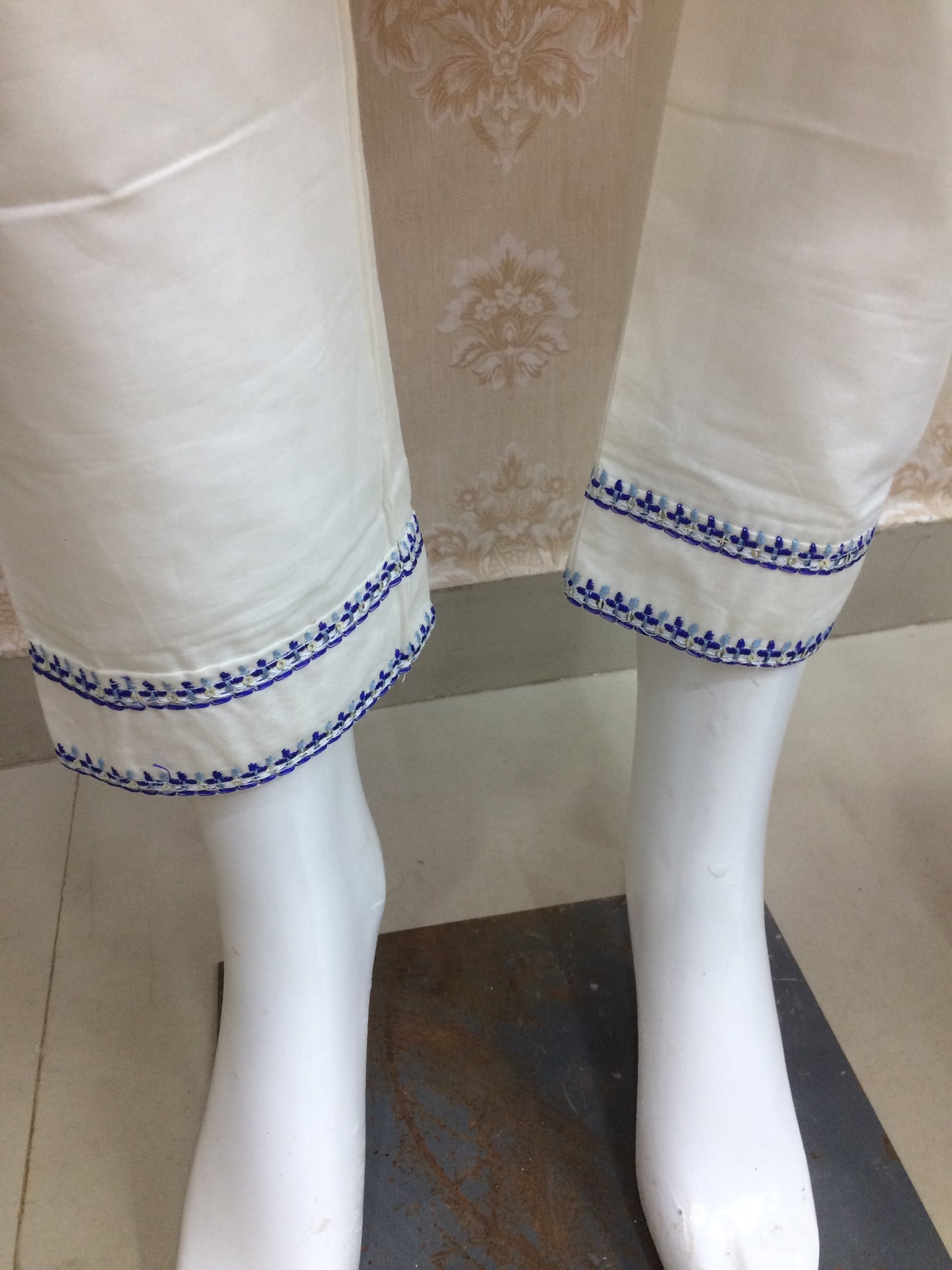White dress blue thread work dress airport
