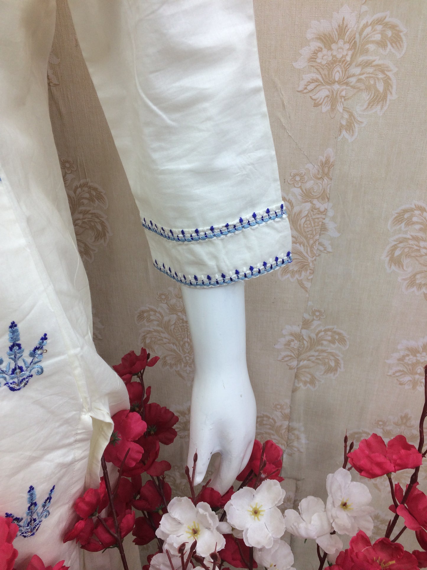White dress blue thread work dress airport