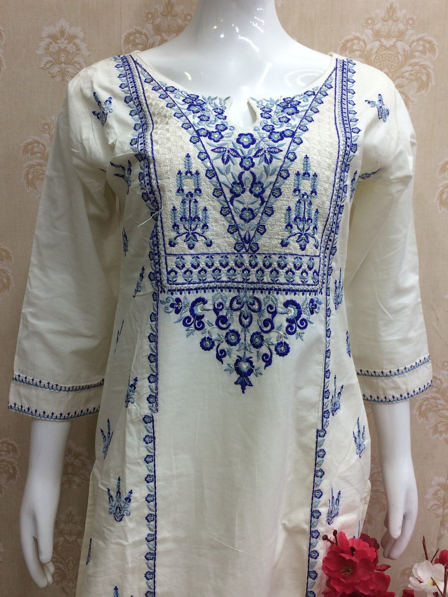 White dress blue thread work dress airport