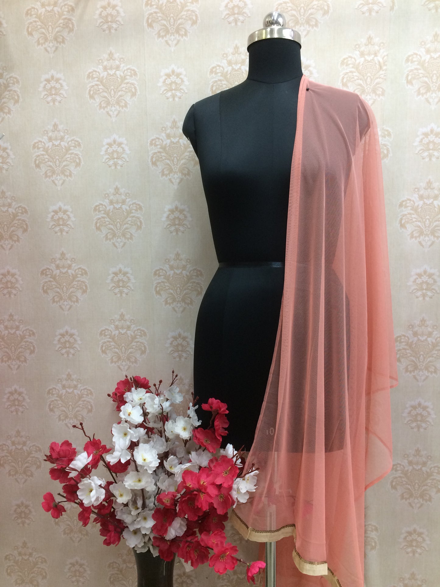 Peach net dupatta with rose gold border